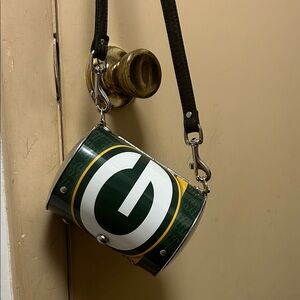 Green Bay Packers Metal Barrel Cross Body Team Logo Purse. Faux leather strap